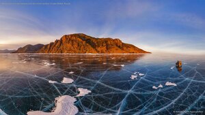 Aerial view of a car crossing over the frozen surface of Lake Baikal, Russia