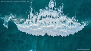 Aerial view of surfer catching a wave, Tenerife, Canary Islands, Spain