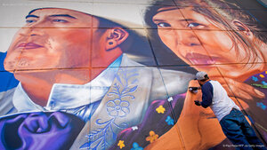 Artist Jesus 'CIMI' Alvarado painting his mural 'Fronterizos' on a wall of the El Paso Museum of Art, El Paso, Texas