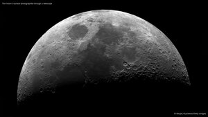 The moon's surface photographed through a telescope