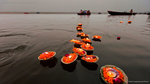Candles floating in the Ganges River, Varanasi, India