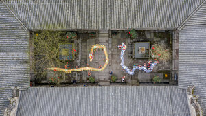Artists performing the dragon dance for Chinese New Year, Luzhou, China
