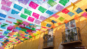 Paper flags strung over a street in San Miguel de Allende, Mexico