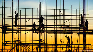 Construction workers on scaffolding
