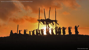 Dancers on a hula pa'a on the site of a lele (altar) on the island of Molokai, Hawaii
