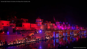 Devotees light oil lamps on the banks of the Sarayu River in Ayodhya, India