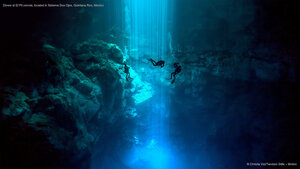 Divers at El Pit cenote, located in Sistema Dos Ojos, Quintana Roo, Mexico