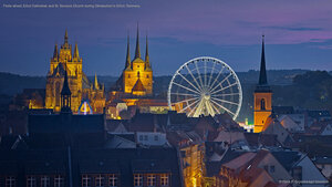 Ferris wheel, Erfurt Cathedral, and St. Severus Church during Oktoberfest in Erfurt, Germany