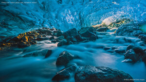 Flowing river inside a glacier cave, Vatnajökull, Iceland
