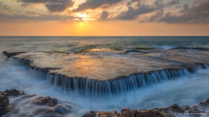 Seawater cascades over an ancient coral reef, Hang Rai, Vietnam