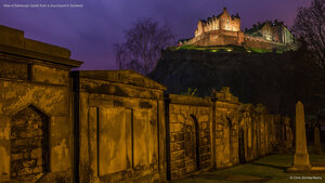 View of Edinburgh Castle from a churchyard in Scotland