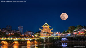 Jiaxiu Tower under a full moon, Guiyang, Guizhou province, China