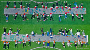 Kindergarteners drawing on canvases in Nantong, Jiangsu province, China