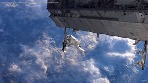 NASA astronaut works on the International Space Station during a spacewalk in 2006