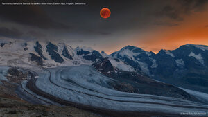 Panoramic view of the Bernina Range with blood moon, Eastern Alps, Engadin, Switzerland