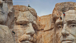 Park service employees inspecting Mount Rushmore National Memorial, South Dakota