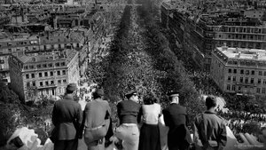 People looking at the crowded Avenue des Champs-Élysées from the Arc de Triomphe on May 8, 1945, Paris, France