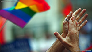 Rainbow flag and clapping hands, New York City
