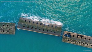 Remains of a Mulberry harbour from the D-Day invasion, Arromanches-les-Bains, Normandy, France