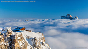 Rifugio Lagazuoi above the clouds with Monte Pelmo in the background, Dolomites, Italy