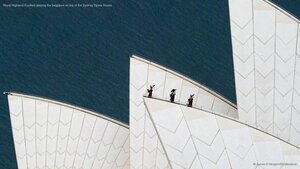 Royal Highland Fusiliers playing the bagpipes on top of the Sydney Opera House