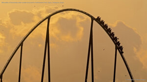 Silhouette of Shambhala roller coaster at sunset in PortAventura Park, Salou, Tarragona, Spain