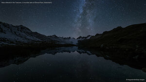 Stars reflected in the Totensee, a mountain lake at Grimsel Pass, Switzerland