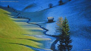 Sun defrosts half a meadow in Tulfes, Austria