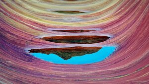 'The Wave' sandstone formation with pools of water in Vermilion Cliffs National Monument, Arizona