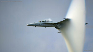 US Navy F/A-18F Super Hornet creating a sonic boom