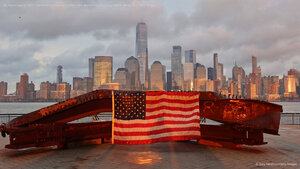 US flag on part of a 9/11 memorial overlooking the New York skyline from Exchange Place, Jersey City, New Jersey