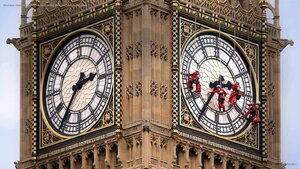 Workers cleaning the clock face of Big Ben in London, England