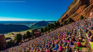 Yoga practitioners at Red Rocks Amphitheatre in Colorado